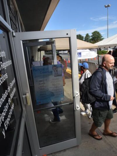 People lined up early voting outside the Gwinnett County Voter Registrations and Elections Office in Lawrenceville on Thursday, October 18, 2018. HYOSUB SHIN / HSHIN@AJC.COM Federal judge mulling action over Georgia absentee ballots.