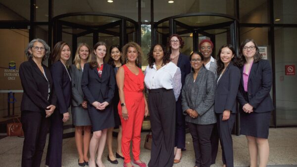 women standing in front of building