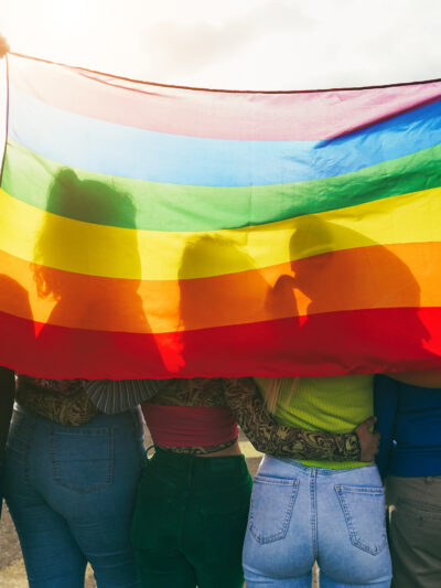 youth with rainbow flag