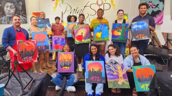 ACLU of Georgia staff with interns at paint and sip event in 2023