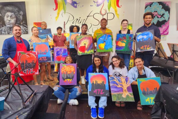 ACLU of Georgia staff with interns at paint and sip event in 2023