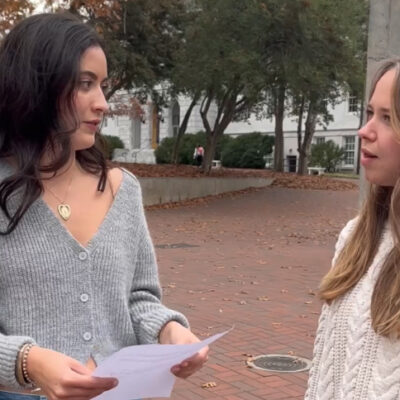ACLU of Georgia comms intern Lena Bodenhamer filming on an Altanta college campus