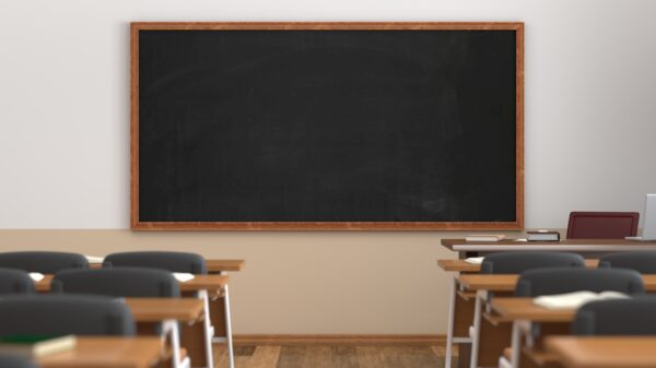 classroom with desks facing chalkboard