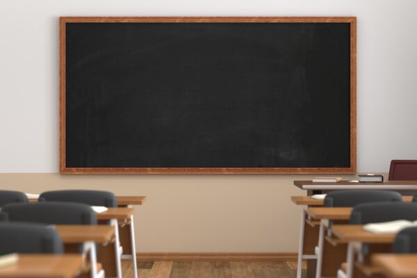 classroom with desks facing chalkboard
