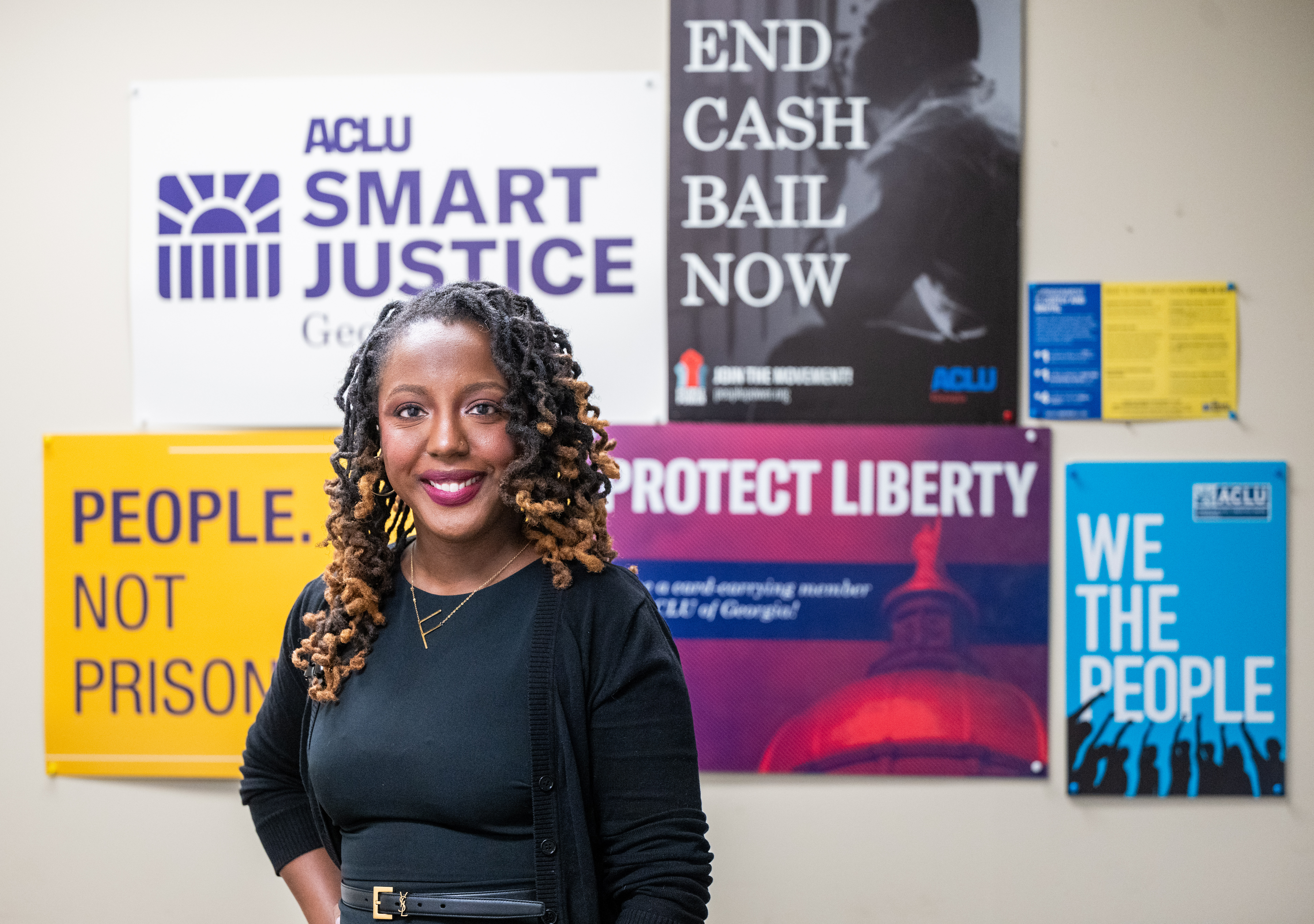 woman standing in front of different signs