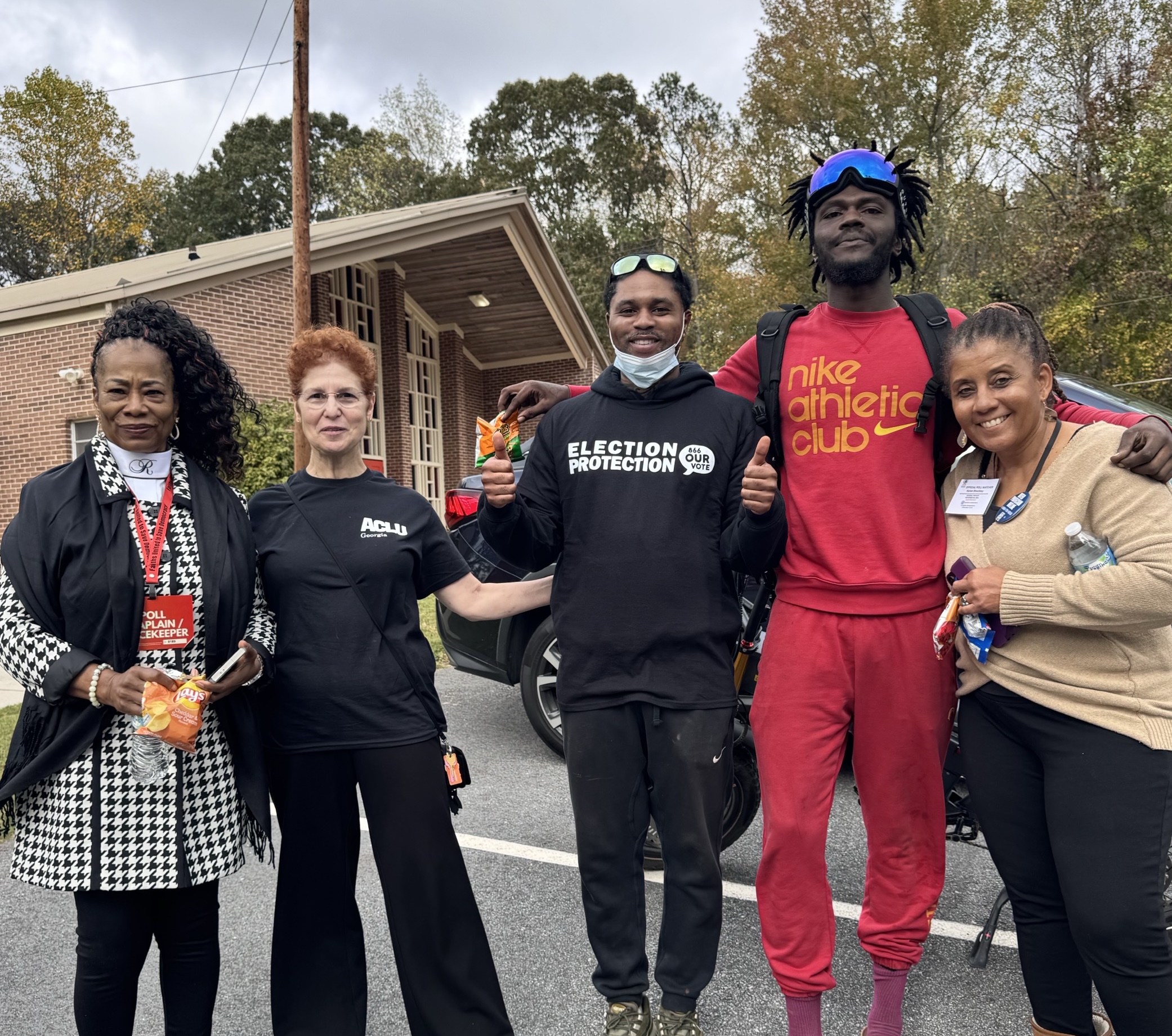 election volunteers standing outside