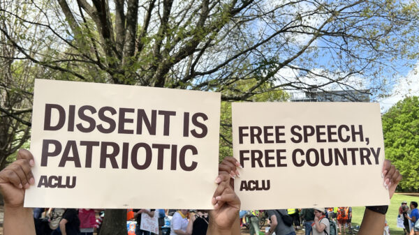 People holding protest signs