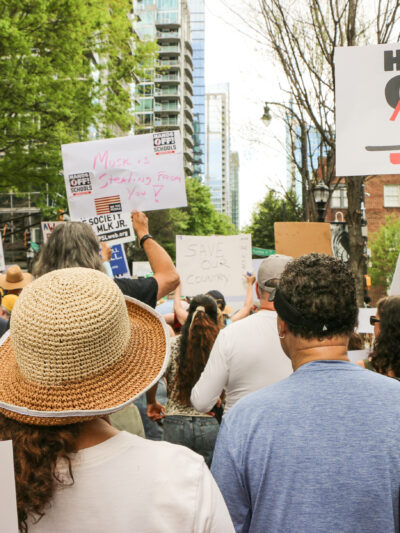 Crowd of protestors, photographed from the back, during Hands Off! Mass Mobilization 2025
