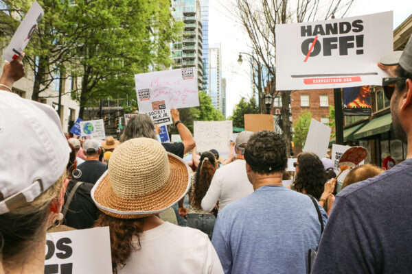 Crowd of protestors, photographed from the back, during Hands Off! Mass Mobilization 2025