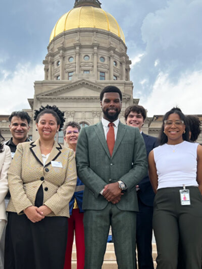 Staff photo in front of capitol from Liberty Plaza