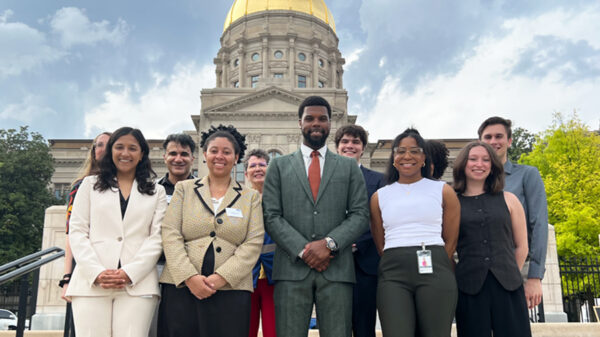 Staff photo in front of capitol from Liberty Plaza