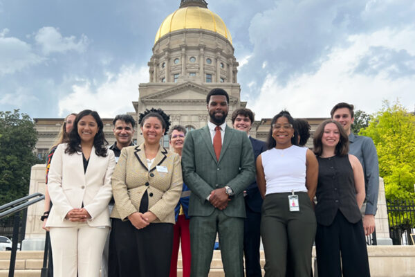 Staff photo in front of capitol from Liberty Plaza
