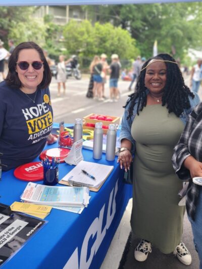 ACLU Georgia volunteersand supporters  smiling at a festival