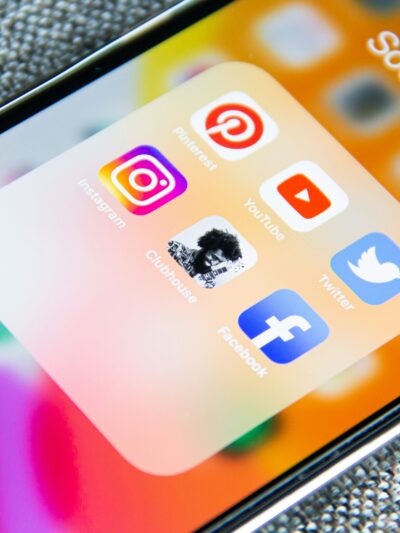 The screen of a mobile phone with social media icons on it
