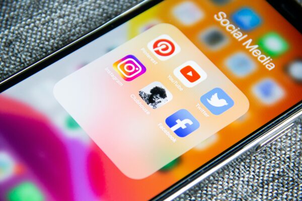 The screen of a mobile phone with social media icons on it