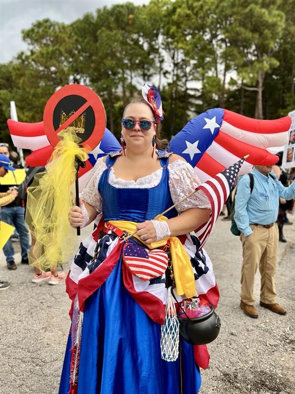 Woman dressed as Lady Liberty from the Schoolhouse Rock song "The Great American Melting Pot," at the No Kings Rally in Atlanta on Oct. 18, 2025.