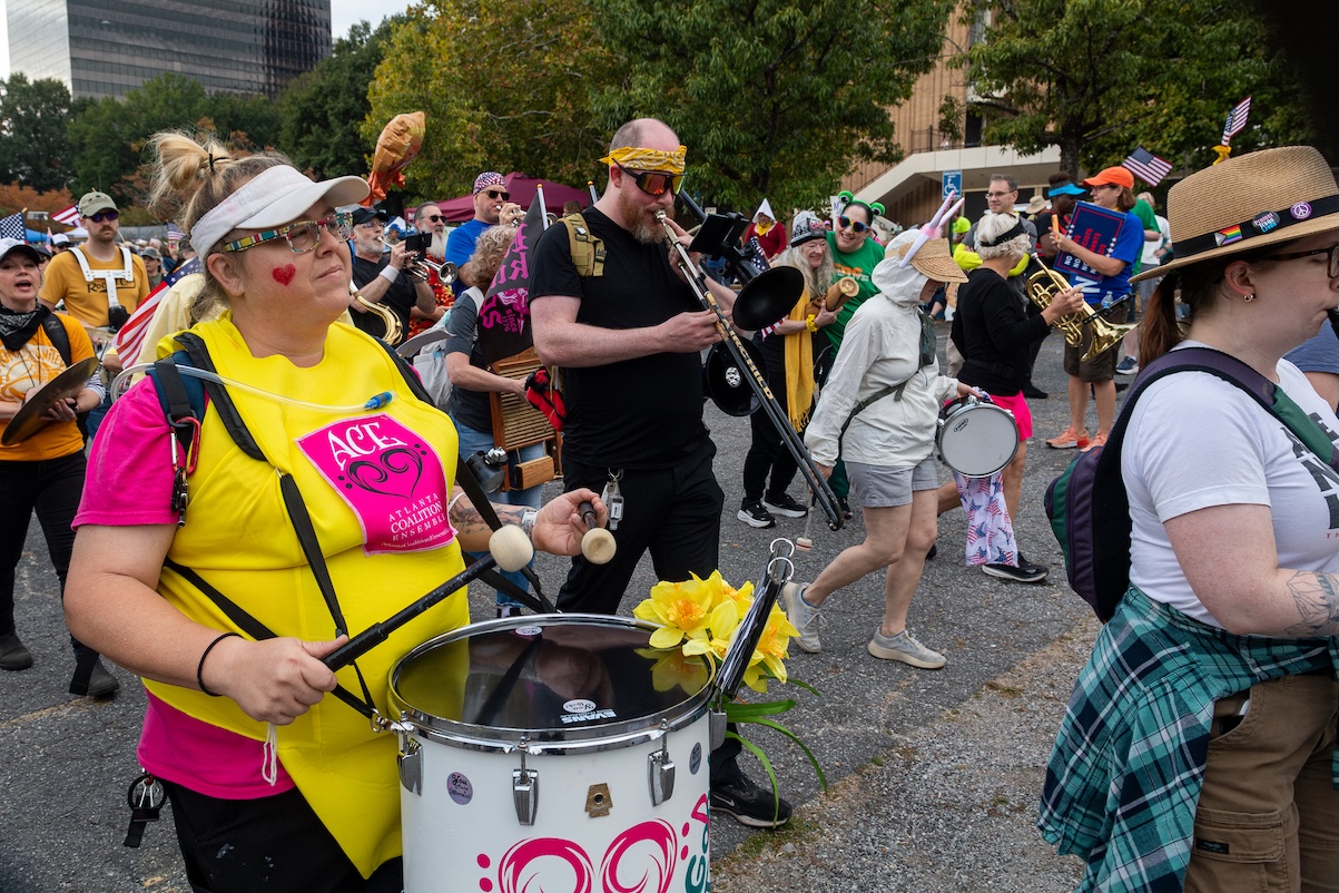 A band plays tunes among the ground at the October 18, 2025 No Kings Rally at the Atlanta Civic Center.