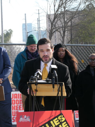 ACLU of Georgia staff attorney speaking at a press conference for a report on Fulton County Jail overcrowding.