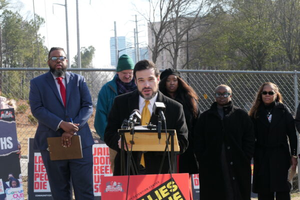 ACLU of Georgia staff attorney speaking at a press conference for a report on Fulton County Jail overcrowding.