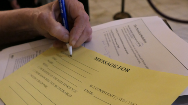 ALCU of Georgia supporter filling out a message to a lawmaker on Crossover Day at the Georgia State Capitol.
