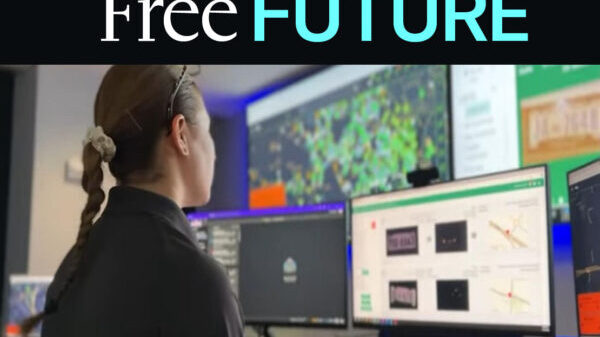 Free Future blog graphic depicting a women looking at computer screens reviewing data
