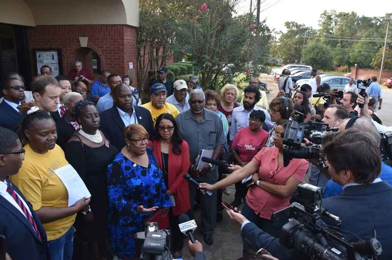 Helem Butler with the People's Agenda, and Andrea Young, Executive Director of the ACLU of Georgia, speak to the press after the vote to keep open all 9 polling places in Randolph County. 