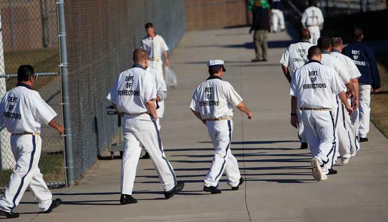 Inmates at Phillips State Prison make their way to the cafeteria Thursday, October 27, 2011