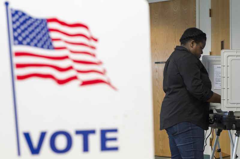 Jujuan Odom, 23, votes at a voting station at the Southwest Branch Library in Atlanta, Georgia, on Tuesday, March 21, 2017. 