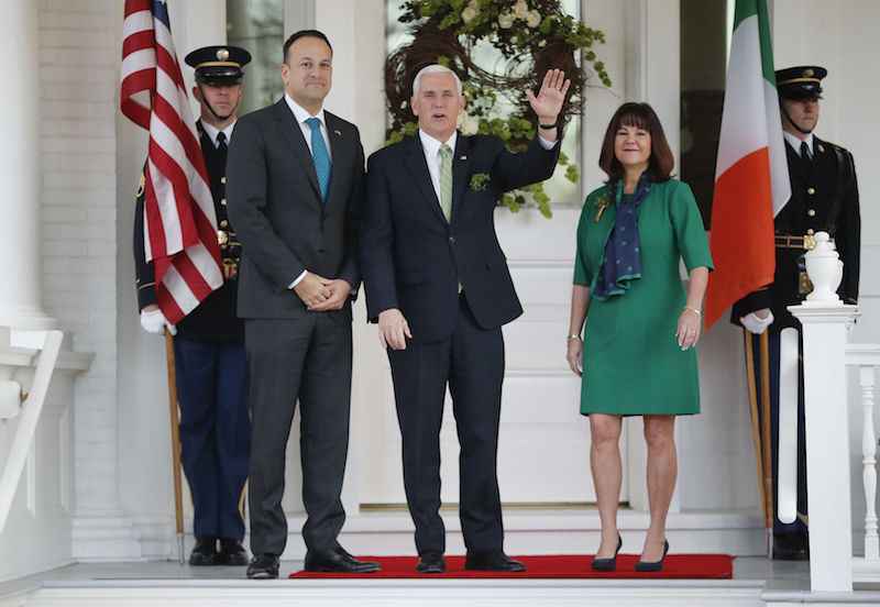 Vice President Pence waving hand, with wife and Ireland's Prime Minister Leo Varadkar