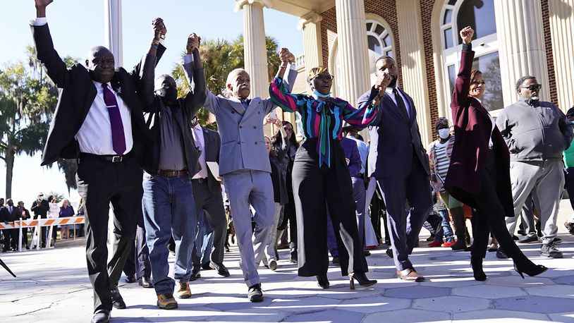 Leaders and pastors exit Brunswick Courthouse with Ahmaud Arbery family after guilty verdicts for his murderers.