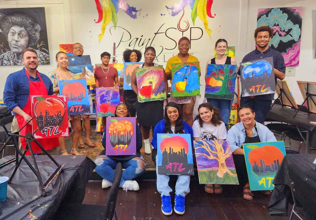 ACLU of Georgia staff with interns at paint and sip event in 2023