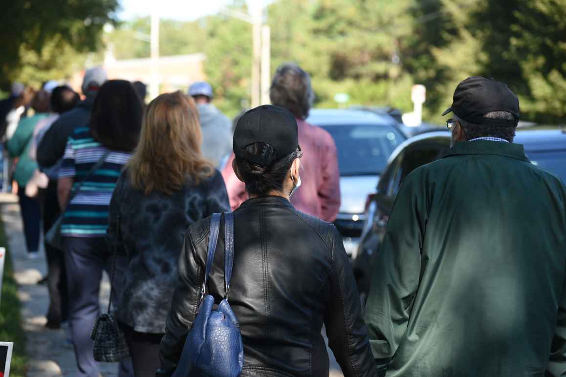 people waiting in line to vote