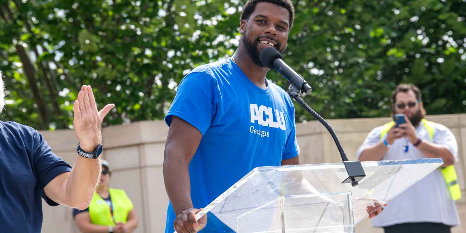 No Kings ACLUGA Policy Director Chris Bruce in front of rally