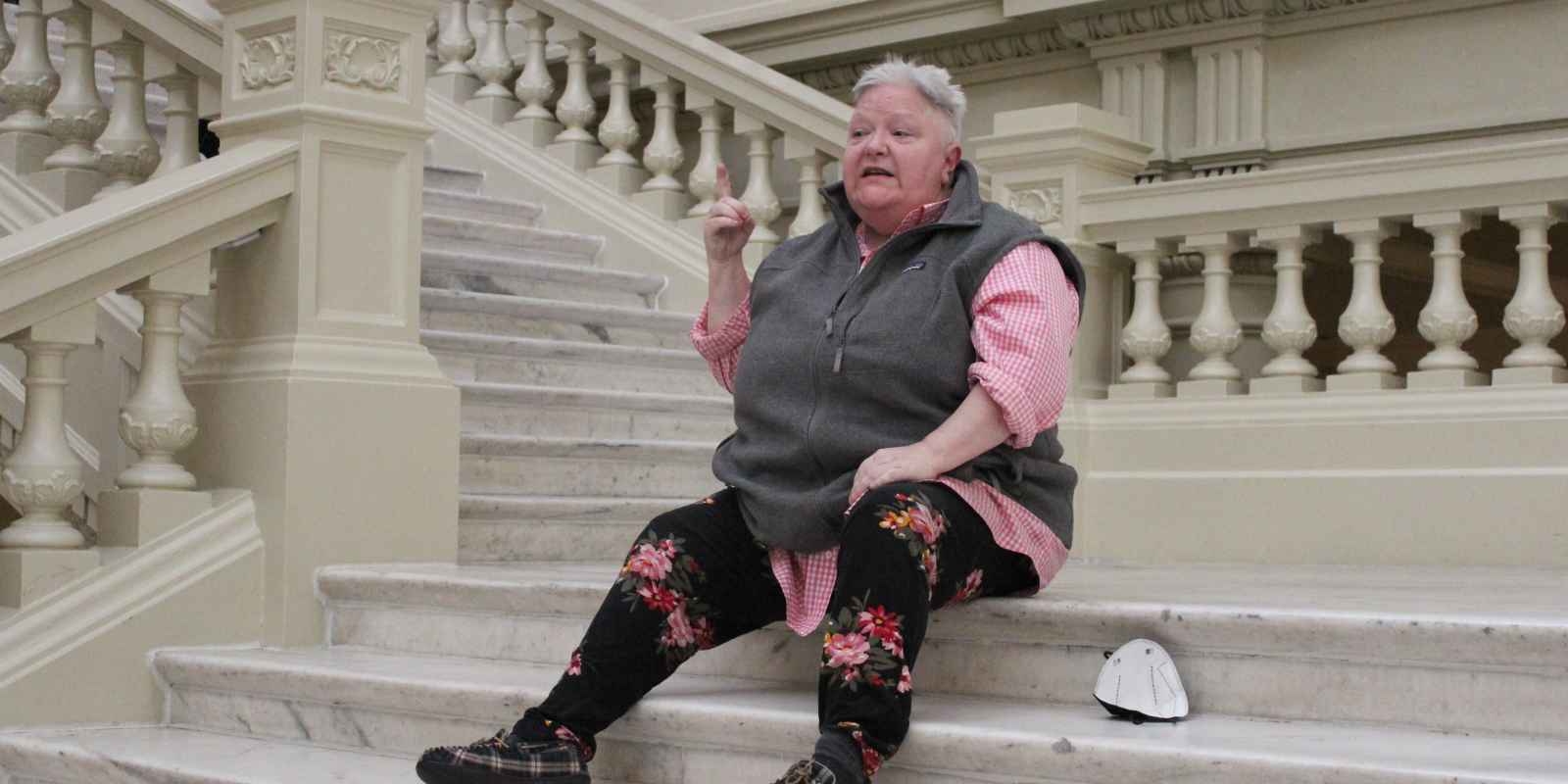 Zan Thorton, with the Georgia chapter of ADAPT (American Disabled for Attendant Programs Today) at the top of the south steps of the Georgia Capitol