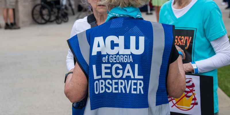 Volunteer wearing ACLU of Georgia legal observer vest