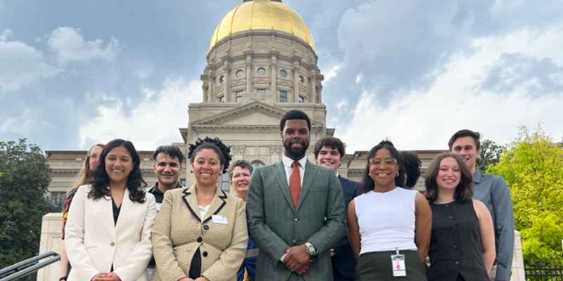 Staff photo in front of capitol from Liberty Plaza