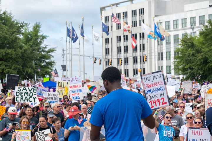 Chris Bruce in front of No Kings rally