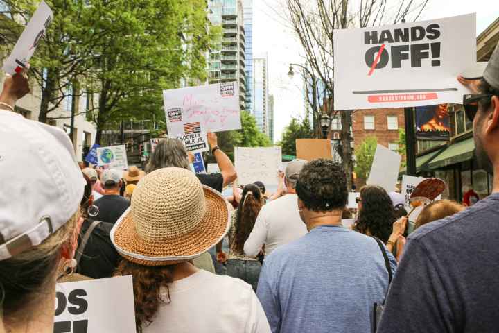 Crowd of protestors, photographed from the back, during Hands Off! Mass Mobilization 2025
