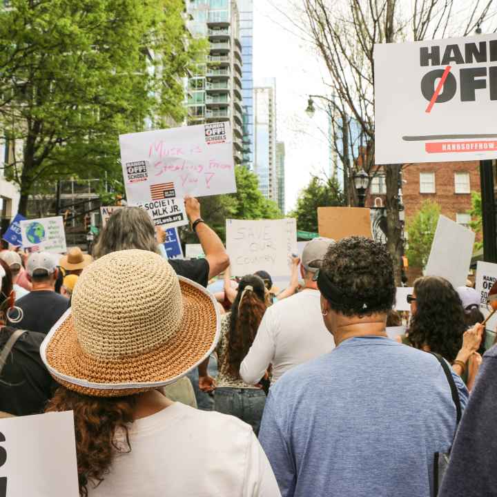Crowd of protestors, photographed from the back, during Hands Off! Mass Mobilization 2025
