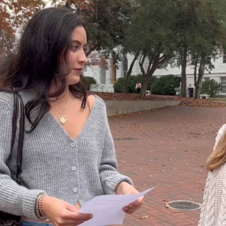 ACLU of Georgia comms intern Lena Bodenhamer filming on an Altanta college campus