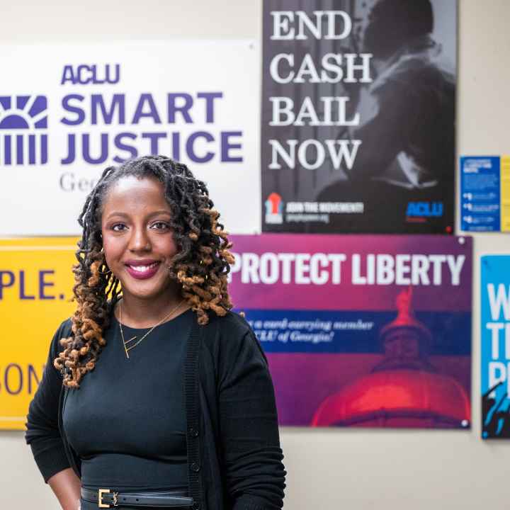 woman standing in front of different signs